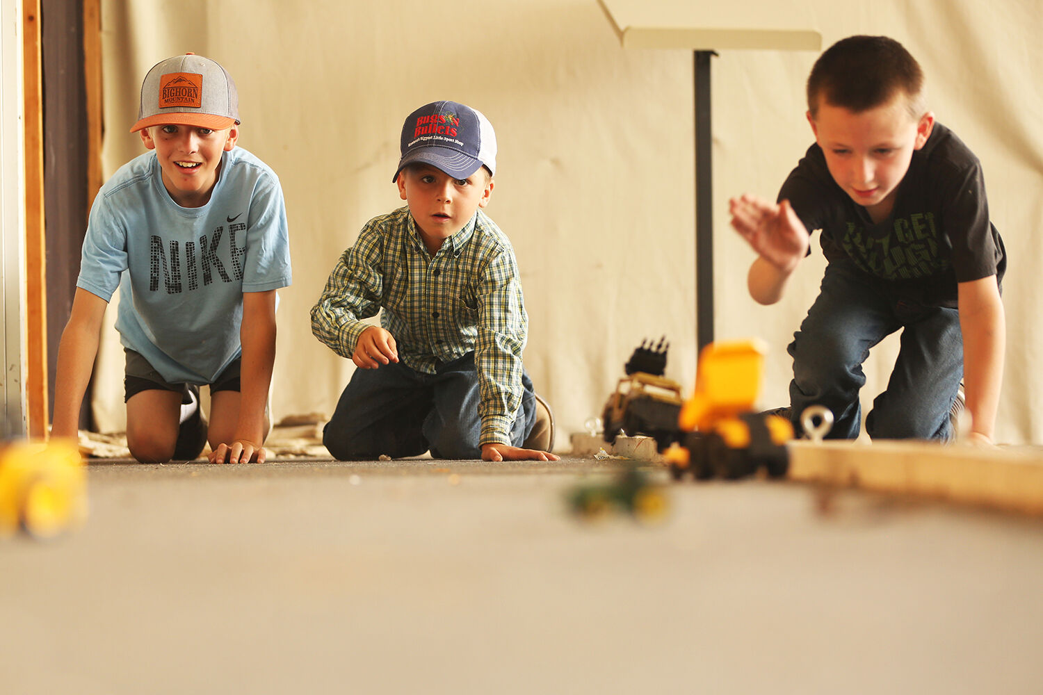 TC Irish, 11, Gable Baker, 7, and Griffin Ruby, 8, watch
